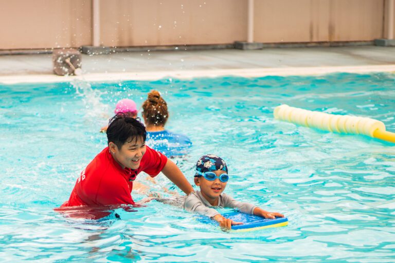 Swim instructor with students