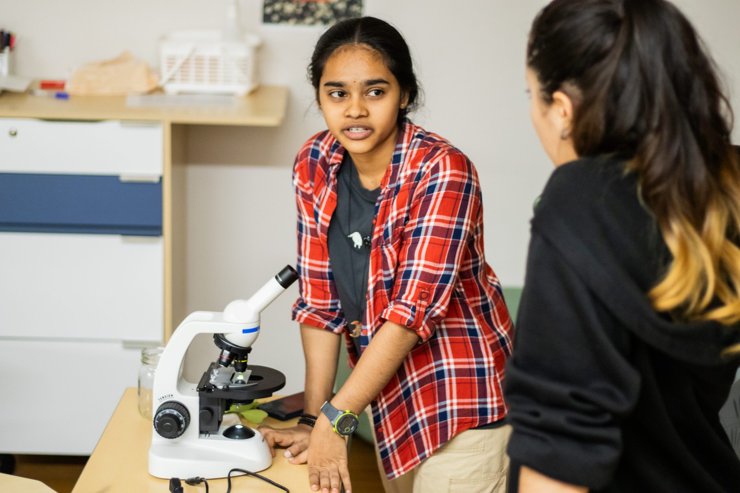 DP students using a microscope