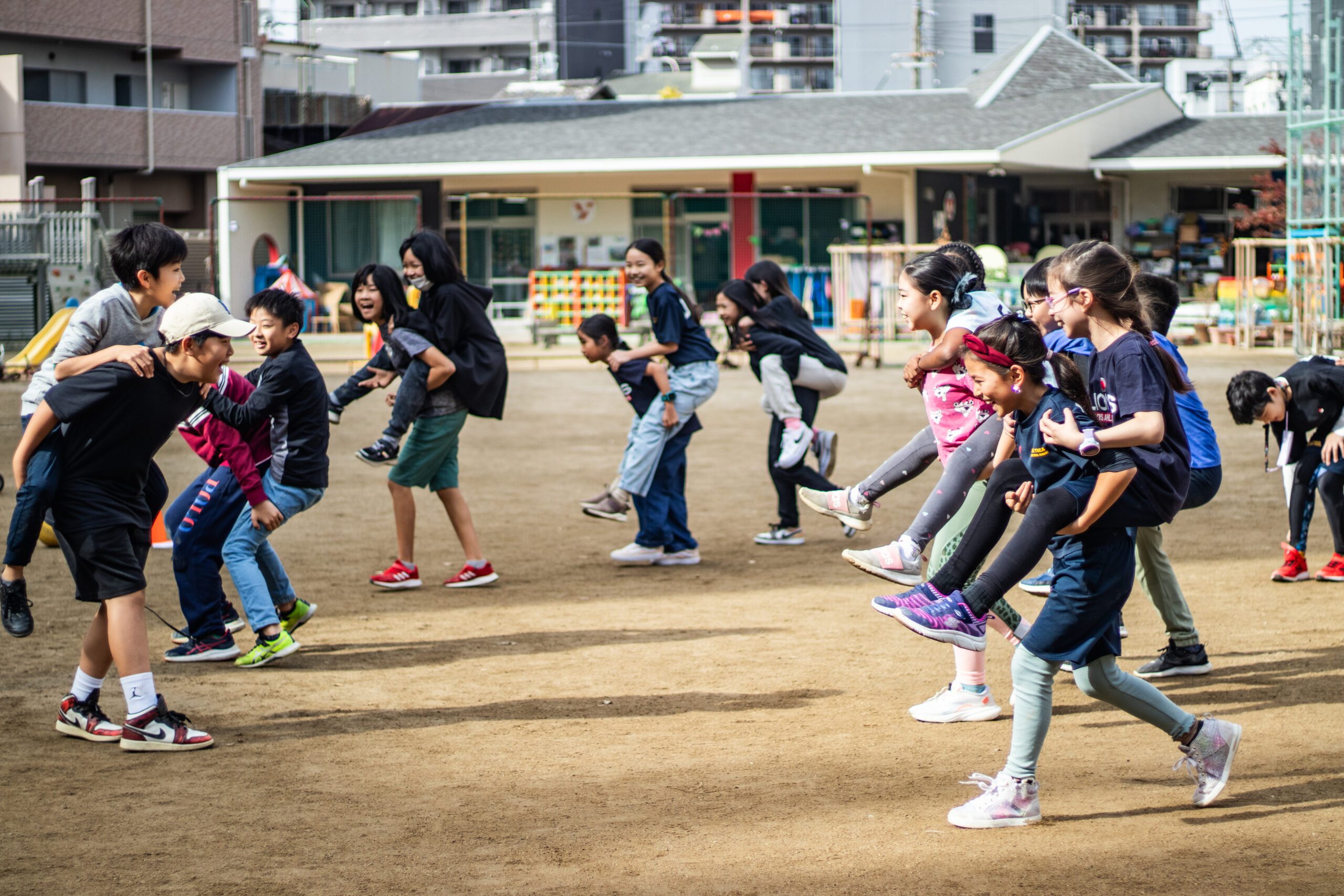 PYP students playing games for outdoor PE class