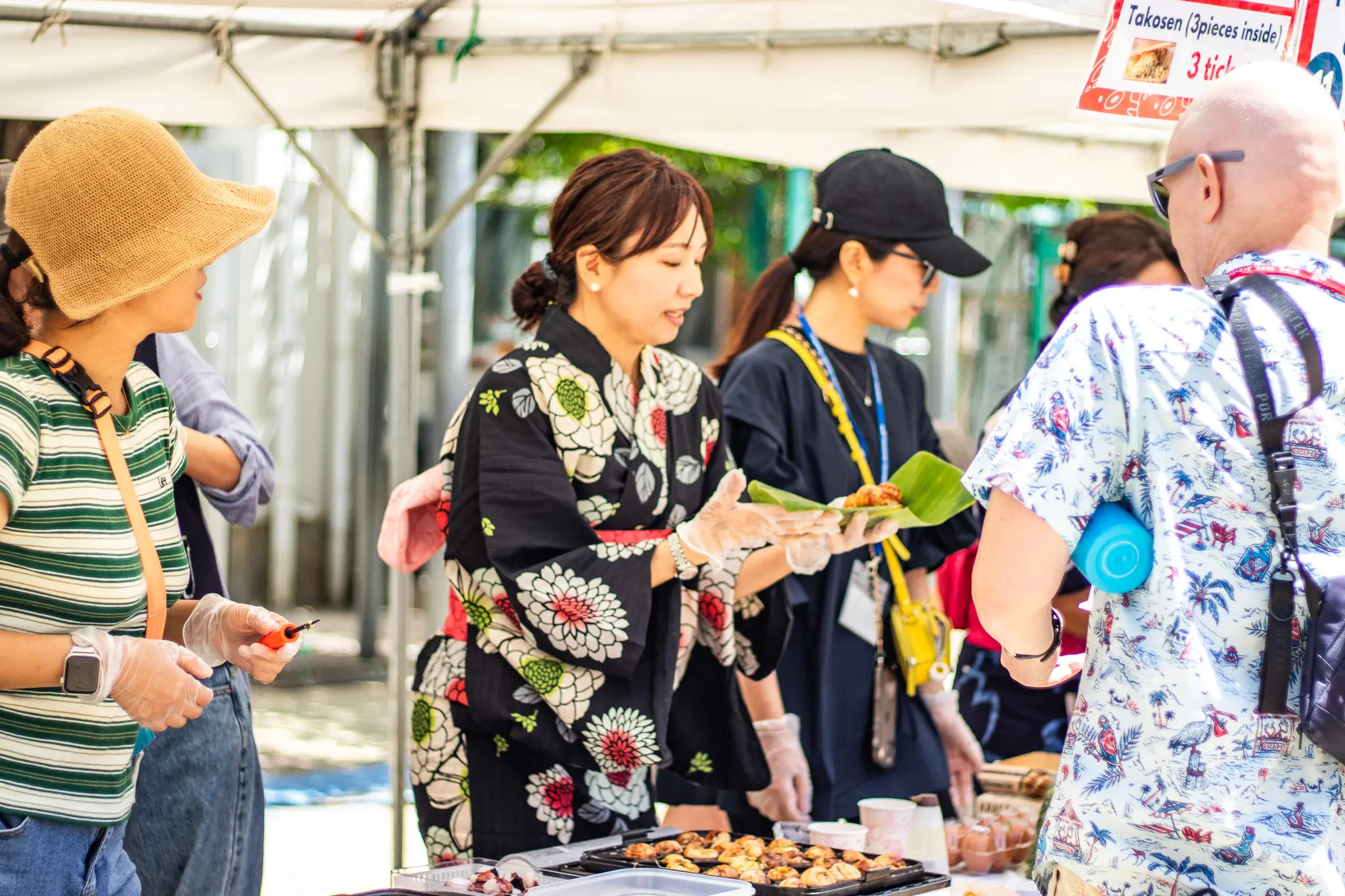 Members of the Parent Volunteer Group (PVG) serving food at the annual school festival