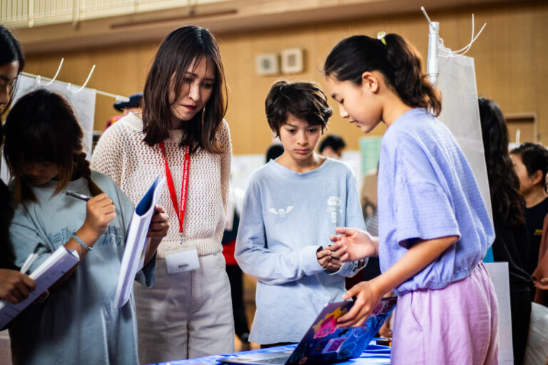 Student presenting a project at the PYP Exhibition